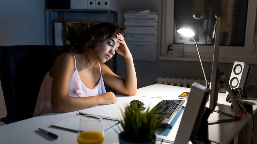 frustrated woman working late